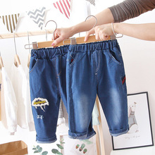 儿童裤子春秋季新款男童女童时尚百搭潮流破洞贴标字母牛仔长裤潮