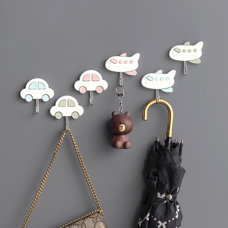 Tienda de departamentos al por mayor ropa creativa gancho de plástico nórdico simple gancho pegajoso fuerte detrás de la puerta cocina 972 gancho pegajoso