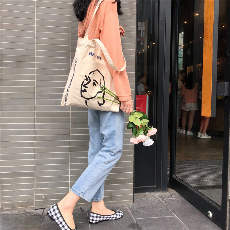 A224 South Korea INS with the same style simple female head printed canvas bag shoulder bag outside pocket art cloth bag