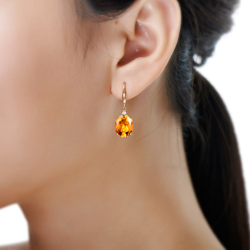 Golden earrings with zircon