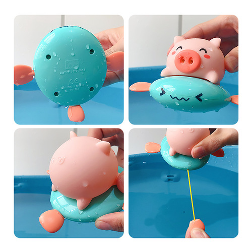Children's wind-up piglet rides a flying fish, baby pulls a string and plays in the water, a whale dinosaur rides a flying fish, takes a bath, sprays water and swims toy