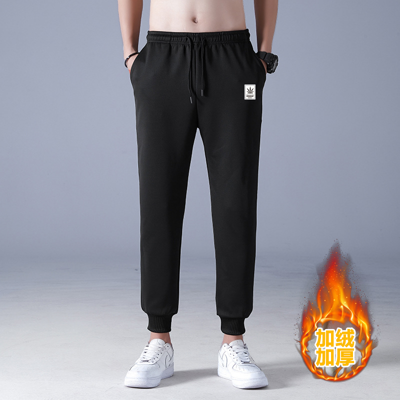 2021 nuevos hombres de invierno forrados de lana engrosada pantalones de algodón de lana de cordero pantalones casuales pantalones de chándal de moda coreana al por mayor