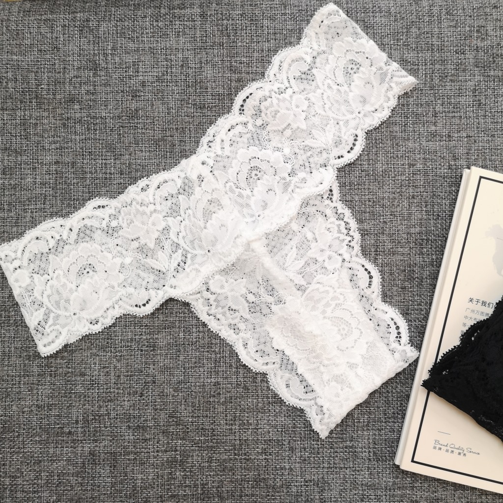 Ropa interior sexy europea y americana de encaje sexy ropa interior de cintura baja transparente ultrafino de las mujeres Tanga T pantalones Calzoncillos K-21