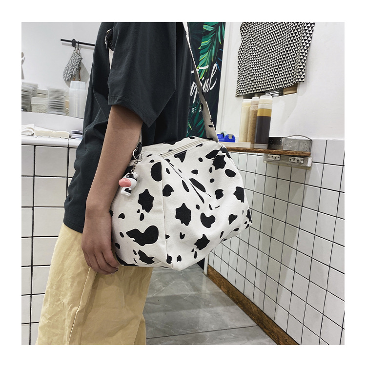 Korean New Simple Lazy Style Cute Cow Polka Dot Student Canvas Bag Class Bag Wild Messenger Bag Wholesale display picture 45