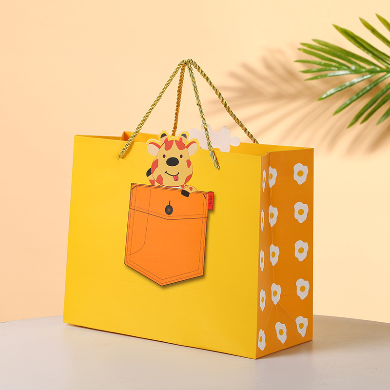 淘宝新款纸袋礼品袋满月生日礼物袋回礼儿童节卡通手提袋厂家批发