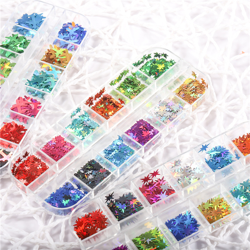 Lentejuelas de uñas populares transfronterizas láser hoja de arce mariposa carta llama lentejuelas DIY caja de tira lentejuelas de uñas