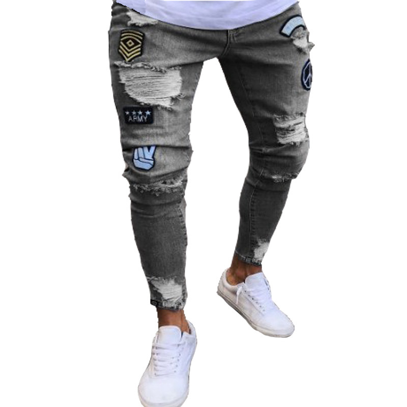 Heren jeans strak model met scheuren en badge details_voghion.com