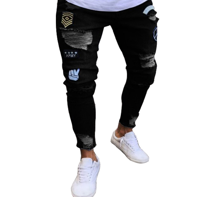 Heren jeans strak model met scheuren en badge details_voghion.com