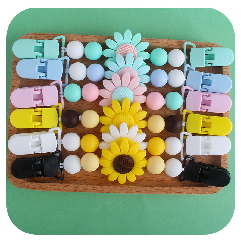 Bebé suministros girasol chupete cadena pañuelo clip bebé calmante silicona Juguete plástico clip de doble cabeza