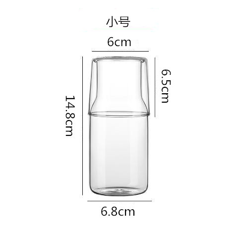 Una persona que bebe vidrio transparente traje de jugo olla leche desayuno taza una olla dos capacidad image 9