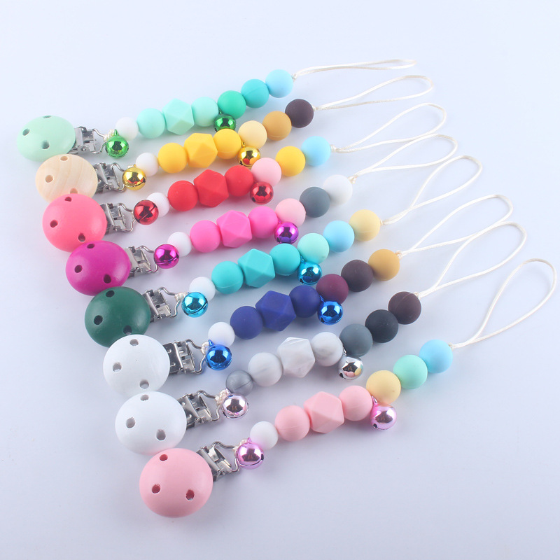 Pequeña campana bebé silicona pezón clip cadena dientes de bebé Cadena de molienda cadena anti-caída calmante teether pezón