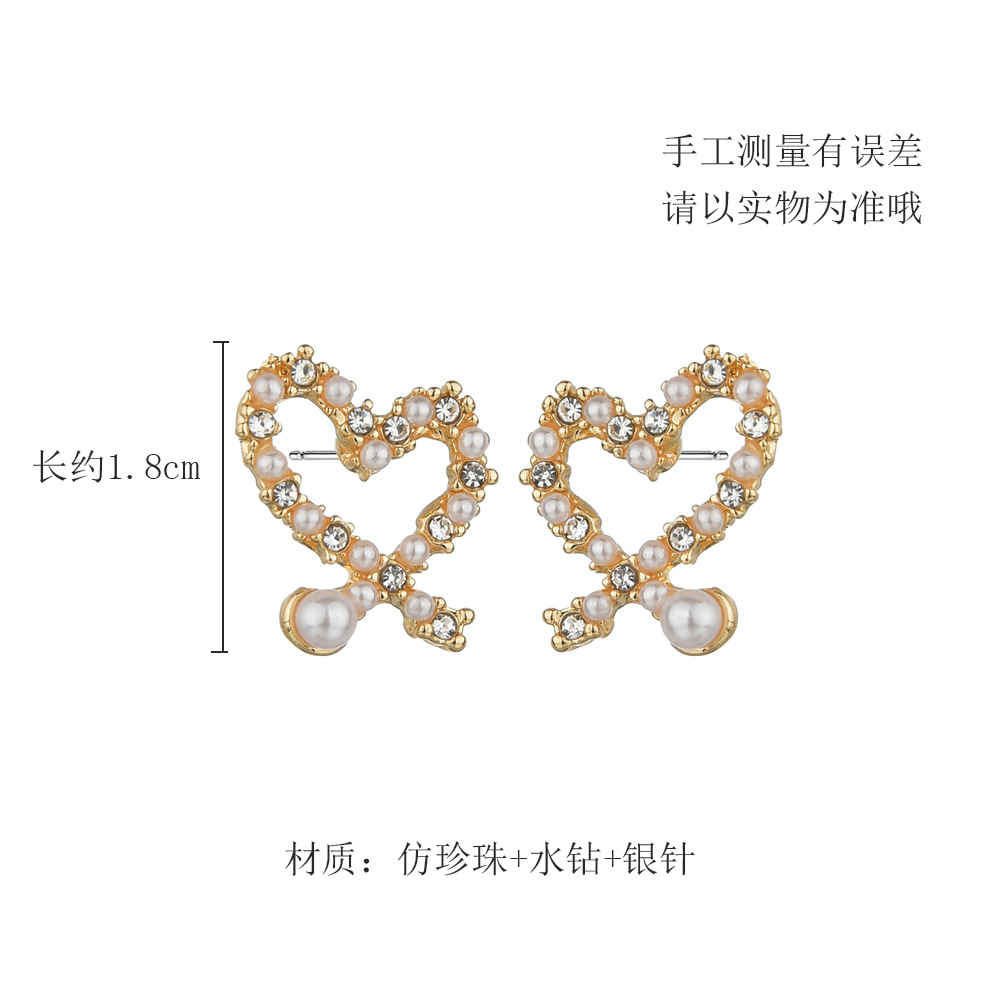 Korean  Irregular Hollow Love Pearl Earrings display picture 5