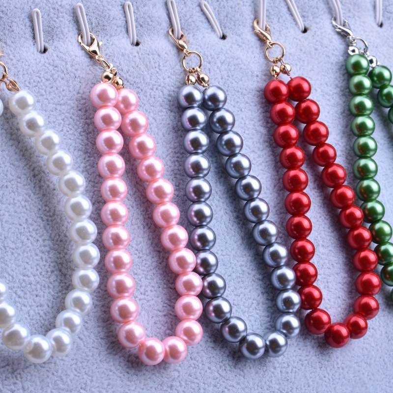 Manufacturers wholesale multicolor short chain imitation pearl hanging chain sugar box hairball keychain mobile phone pendant jewelry accessories