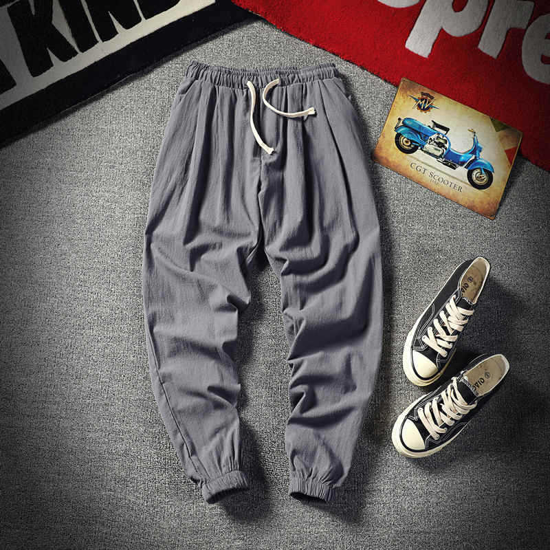 Pantalones cortos de los hombres recortados versátiles estilo coreano Pantalones deportivos de moda Pantalones de verano sueltos de los hombres pantalones atados al tobillo pantalones casuales pantalones de los hombres flacos