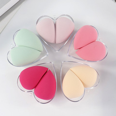 Manufacturer supplies creative new heart-shaped powder puffs. Makeup tools turn into large Easter eggs when exposed to water. Apply makeup without eating powder puffs.