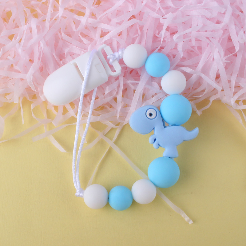 Pequeño dinosaurio bebé silicona pezón clip Cadena de dientes de bebé Cadena de molienda cadena anti-gota calmante teether pezón