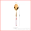 Red stone tip spoon