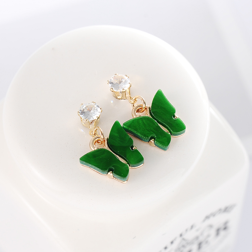 Style Coréen Vente Chaude Couleur Douce Zircon Acrylique Boucles D'oreilles Papillon Boucles D'oreilles Simples En Gros Nihaojewelry display picture 6