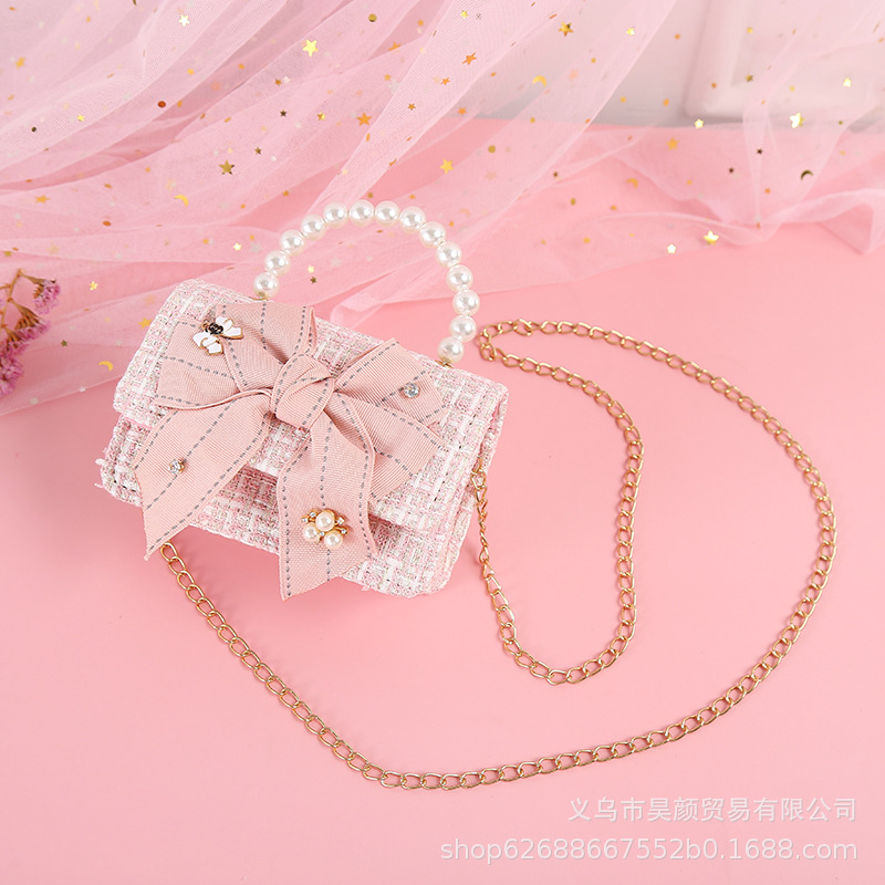 2021 estilo Chanel nueva versión colorida mariposa nudo portátil perla hombro crossbody bolso de los niños 923