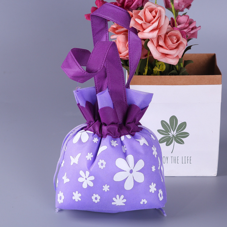 厂家专业生产定做无纺布束口袋 花边抽绳礼品袋 喜糖袋