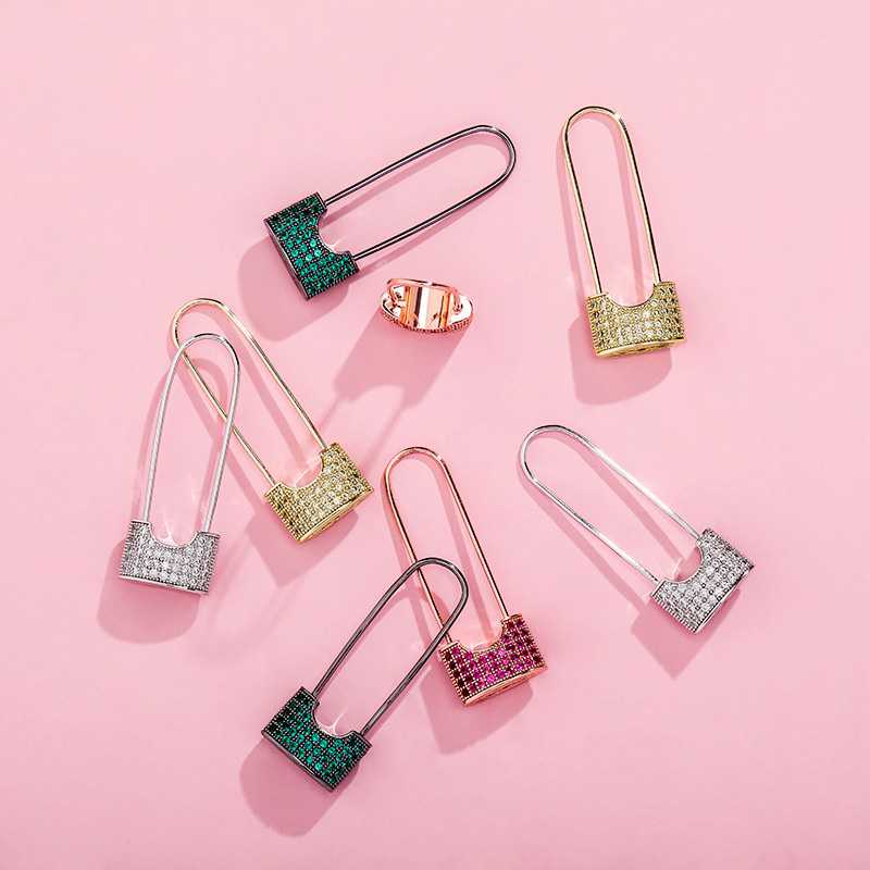 Brand earrings with zircon