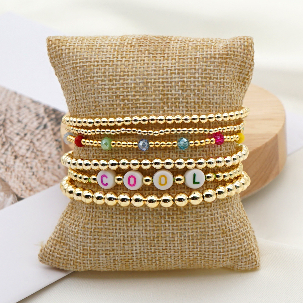 Fashion Trend Natural Pearl Soft Ceramic Multi-layered Beaded Imported Color-preserving Gold Bead Letter Bracelet display picture 1