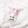 Lying on a small white cat
