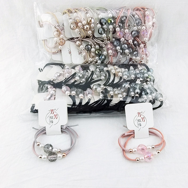 A3125 más de cristal accesorios banda de goma banda de pelo cuerda de pelo tocado 2 yuanes tienda de distribución al por mayor
