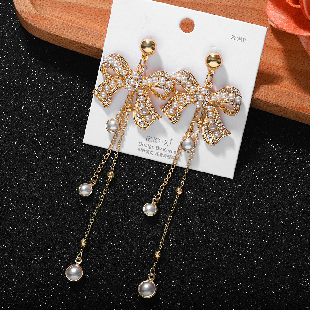 Korean Fashion Exquisite Bow Earrings Female New Chain Tassel Rhinestone Silver Needle Earrings display picture 6