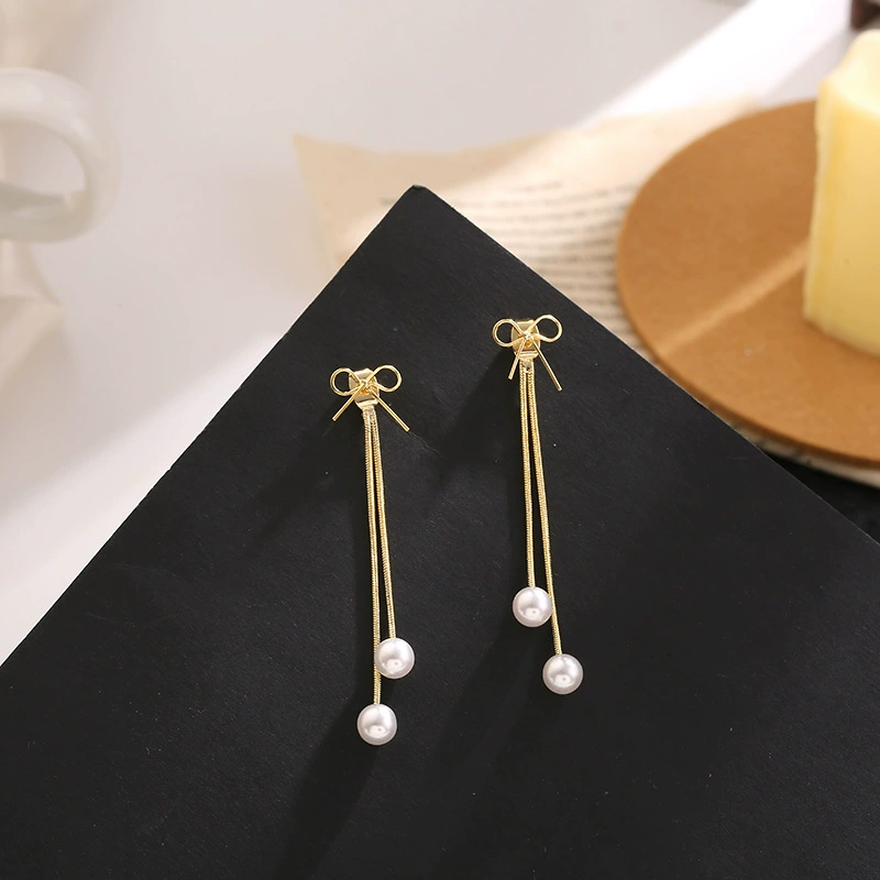 Universal earrings with bow from pearl, silver 925 sample