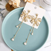 Silver needle with bow, long elegant fashionable earrings from pearl with tassels, diamond encrusted, silver 925 sample
