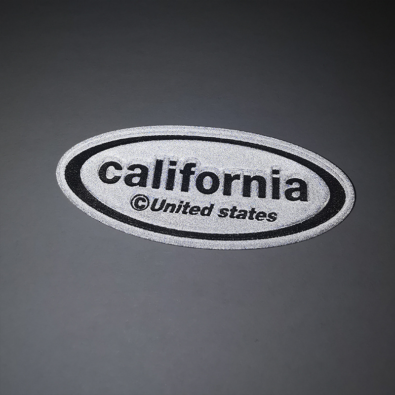 厂家供应丝网印电压反光标 TPU材质服装反光皮标 高周波反光商标