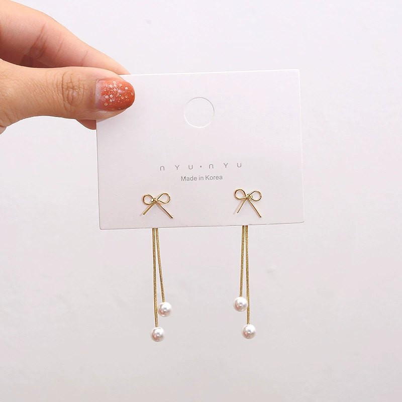Universal earrings with bow from pearl, silver 925 sample
