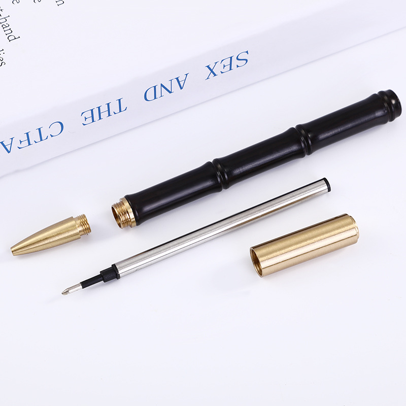 Fábrica al por mayor de bambú de latón pluma de madera letras de metal firma pluma de sándalo pluma de regalo creativo