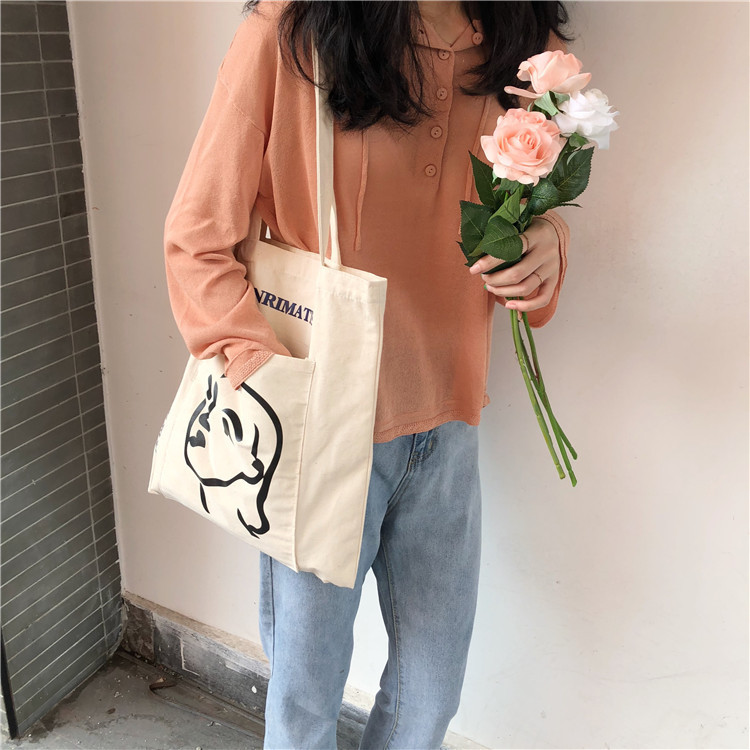 A224 South Korea INS with the same style simple female head printed canvas bag shoulder bag outside pocket art cloth bag