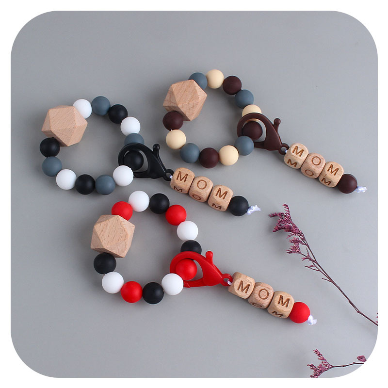 Nueva DIY creativo mamá langosta hebilla colgante de haya octogonal pulsera mordedor traje infantil silicona teether palo