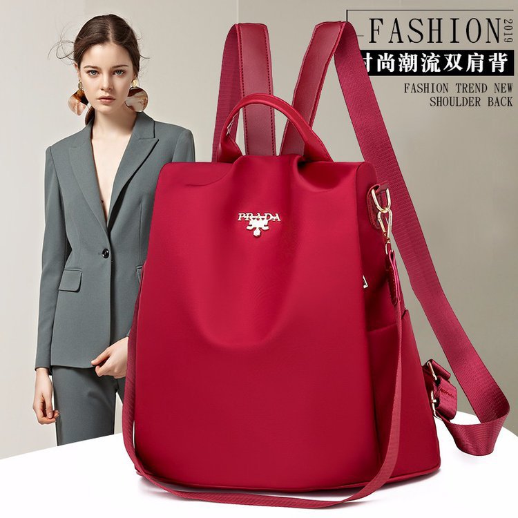 Nuevo estilo de campus de gran capacidad de nylon impermeable antirrobo viaje multifuncional estilo coreano mochila mujer color sólido todo a juego