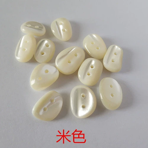 High -end natural alien shell button white shirt knit sweater irregular cobblestone oval shell button