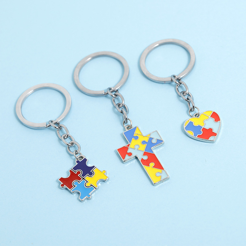 Creative Children's Puzzle Wild Four-color Puzzle Drop Oil Splicing Color Heart-shaped Cross Key Ring Pendant Wholesale Nihaojewelry display picture 1
