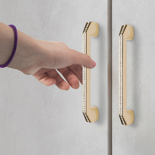 Light luxury-style wardrobe door solid gold handle, simple European-style crystal drawer with rhinestone accents, modern silver metal handle—high-end.