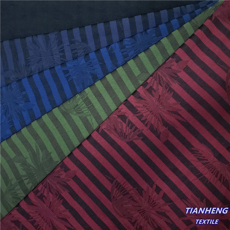 现货涤棉罗缎植物花提花 时尚男女装裤装外套帽子箱包面料批发