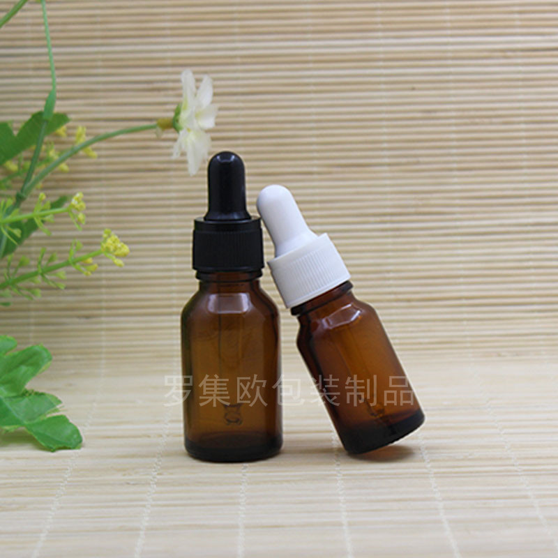 Brown botella de aceite esencial perfume gotero botella de prensa cosmético de vidrio sub-embalaje marrón mezcla botella vacía cabeza de goma de grano fino negro
