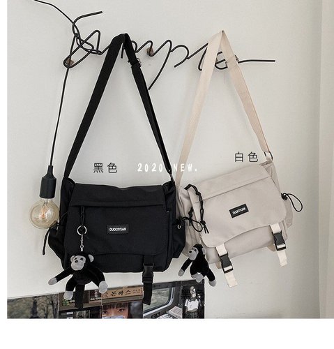 Hong Kong fashion brand couple shoulder backpack new Korean version simple male and female student crossbody bag tooling tutorial bag