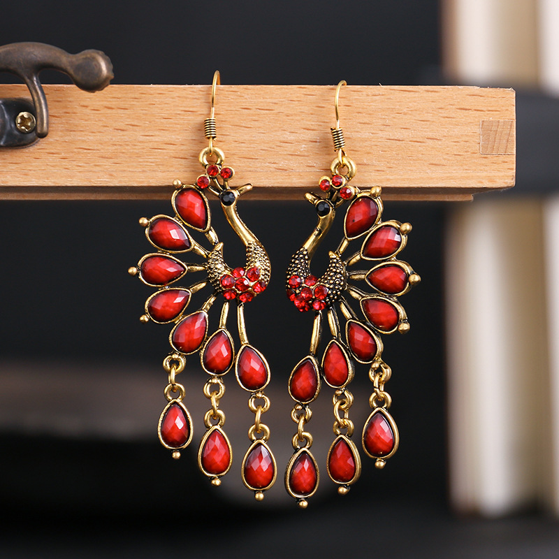 Retro Peacock Ethnic Style Hollow Long Earrings Inlaid Diamond Alloy Earrings display picture 3