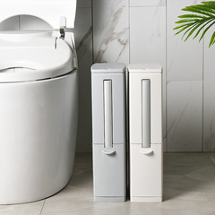Japanese-style bathroom with toilet brush set, narrow gap trash can, and compact, one-piece, push-button toilet lid for home use