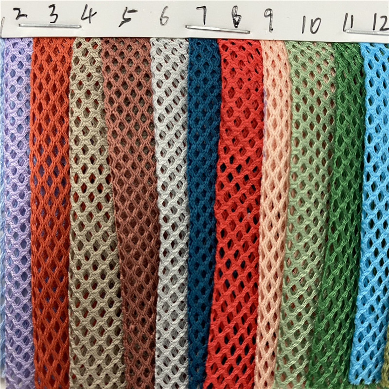 厂家直销 涤纶2*2菱形网眼布 婚纱礼服网布 经编时装面料