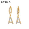 Fashionable earrings with letters, big zirconium, micro incrustation