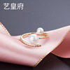 Golden fashionable brand quality ring from pearl, silver 925 sample, diamond encrusted, on index finger