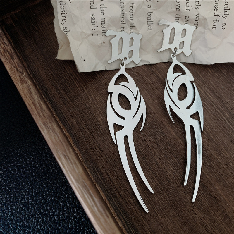 Cool Wave Sanskrit Alphabet Earrings Flame M Word Titanium Steel Earrings Hollow Earrings Wholesale Nihaojewelry display picture 12