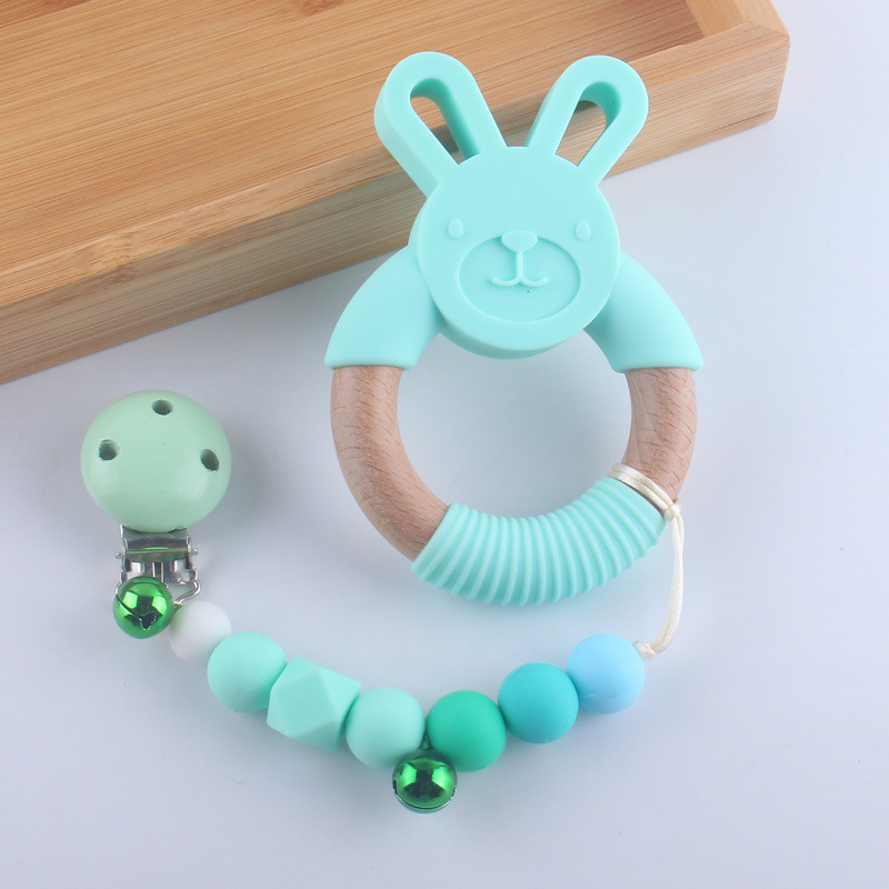 Pequeña campana bebé silicona pezón clip cadena dientes de bebé Cadena de molienda cadena anti-caída calmante teether pezón